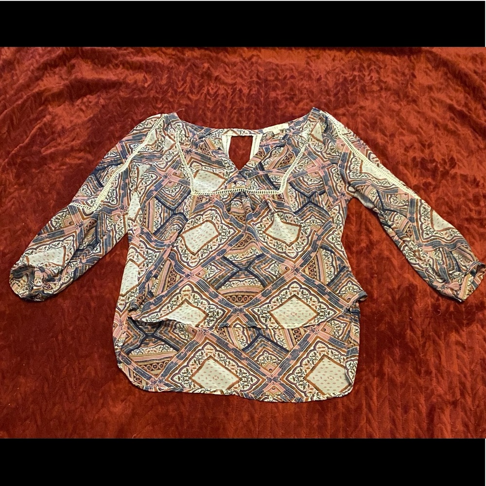 Lady’s dress blouse with V neckline.